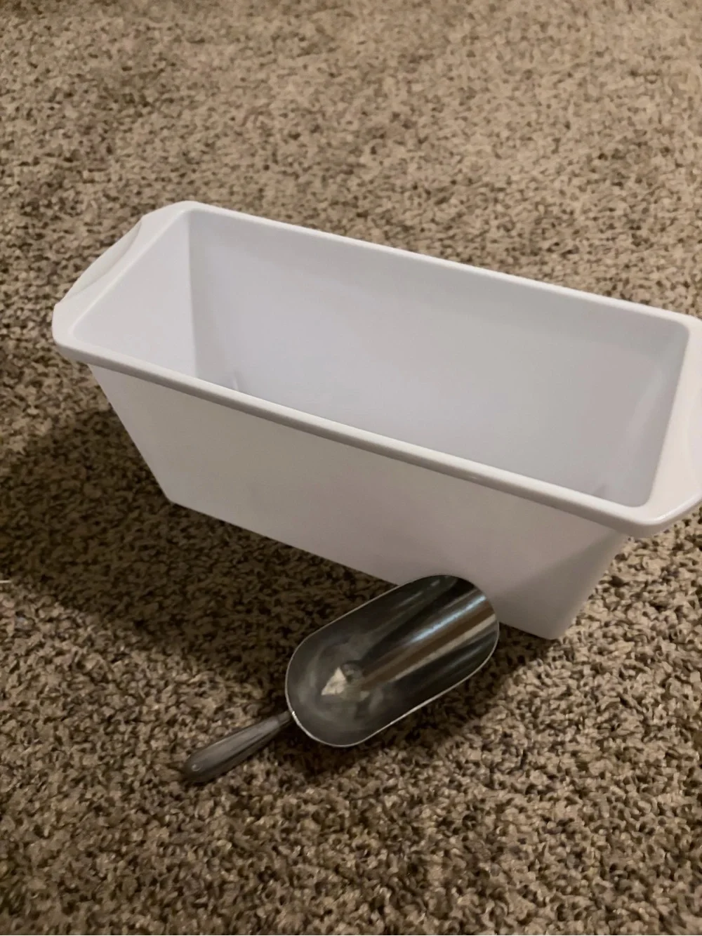 Assorted ice cube trays, scooper and storage